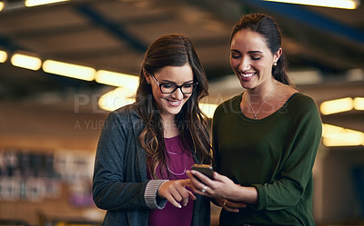 Buy stock photo Business people, typing and women in office, smartphone and social media with connection, texting and smile. Employees, mobile user and coworkers with cellphone, communication and message to contact