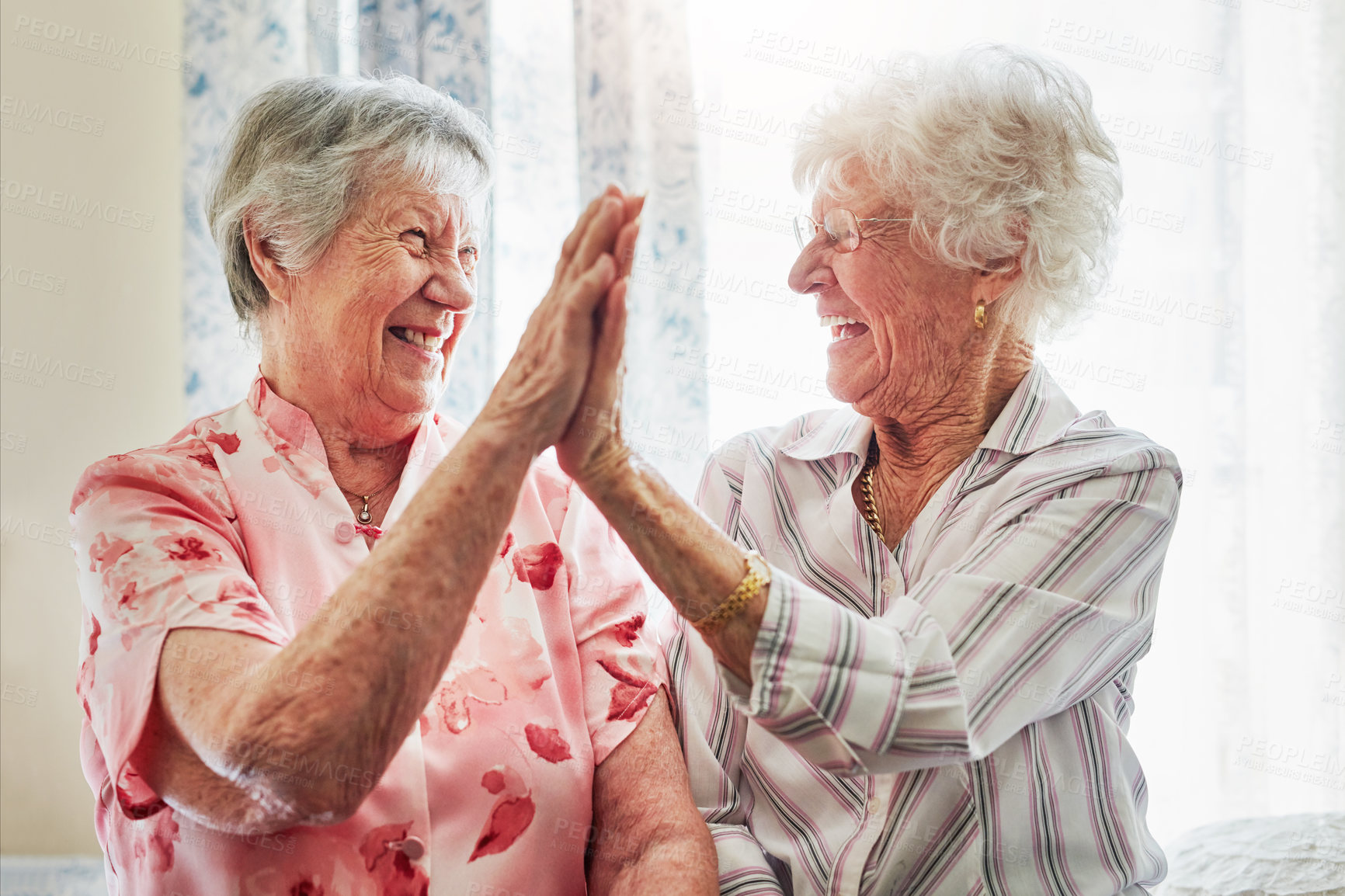 Buy stock photo Happy, love and senior women with a high five for care, retirement support and happiness. Smile, team and elderly friends with excited gesture for solidarity or lifestyle in a nursing home together