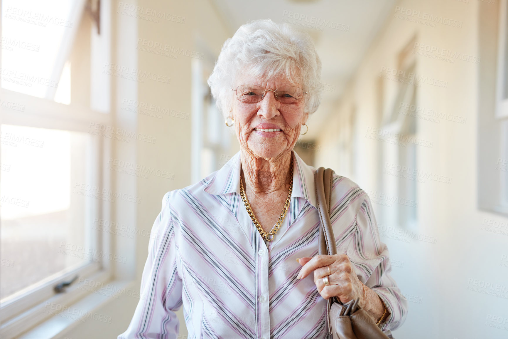 Buy stock photo Portrait of a happy elderly woman getting ready to go out