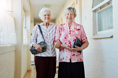 Buy stock photo Portrait of two happy elderly women carrying their bags and getting ready to go out