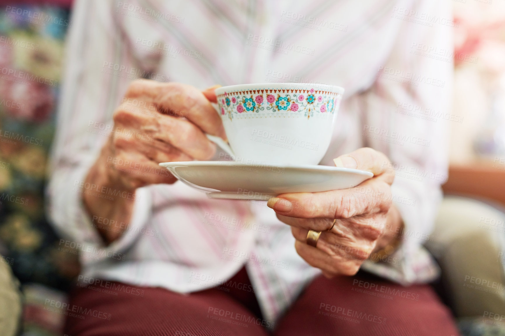 Buy stock photo Cropped shot of s senior woman having a cup of tea
