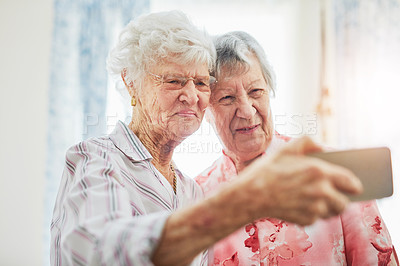 Buy stock photo Elderly, women and friends or happy with selfie for profile picture, memory or visit in retirement. Senior, people or smile for photography with bonding, reunion and support with care in nursing home