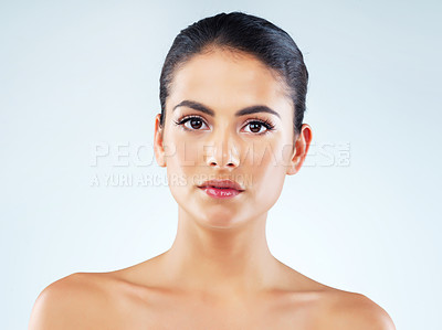 Buy stock photo Skincare, portrait and woman in studio with confidence for facial treatment, cosmetics or dermatology with blue background. Skin, aesthetic and female model for natural glow, shine or cosmetology