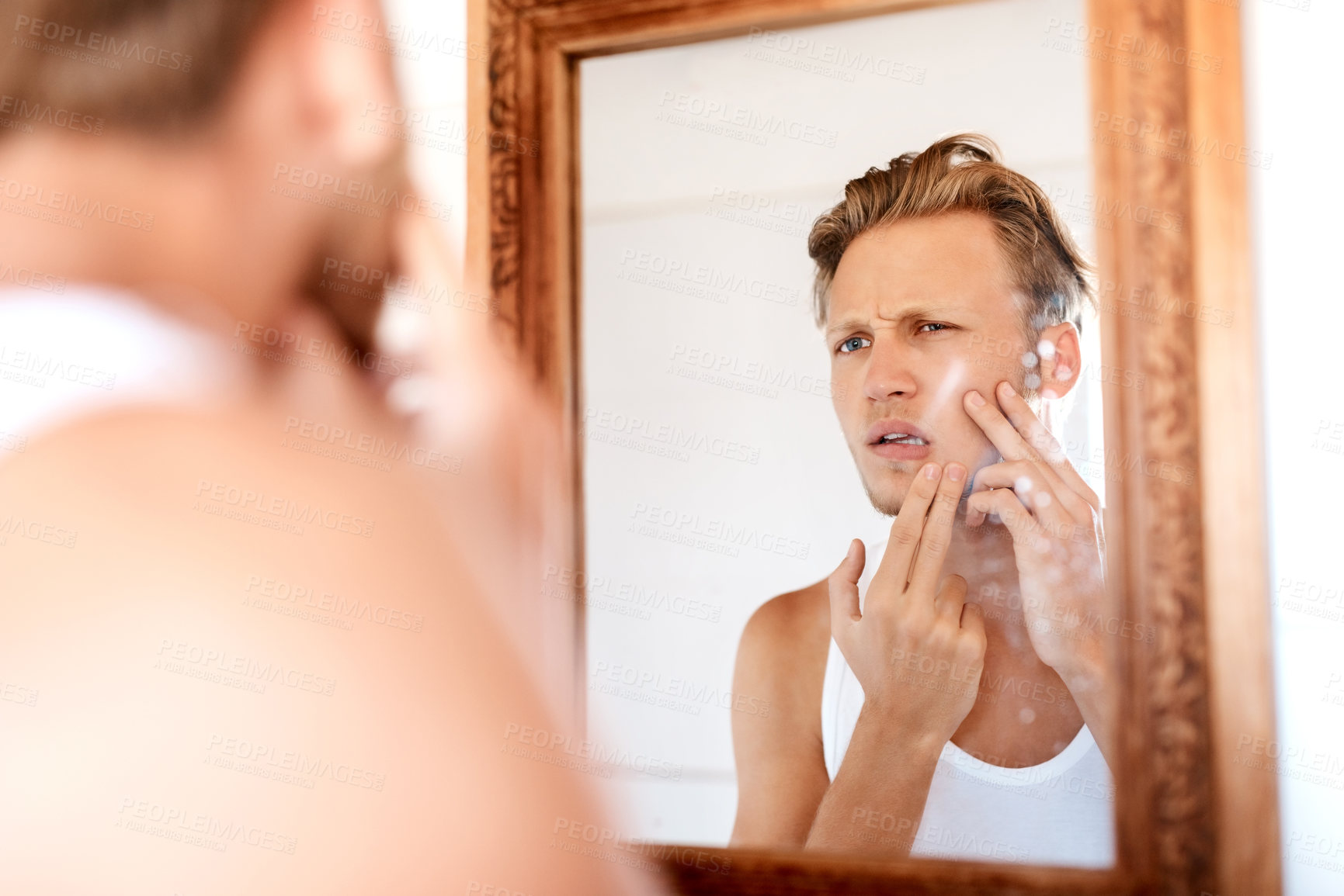 Buy stock photo Man, acne and pimple in mirror of bathroom with facial cleaning, grooming and confused with skincare. Personal hygiene, person and unhappy with breakout, blackhead scar and morning routine in home