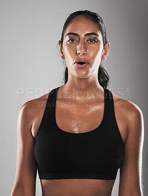 Buy stock photo Studio shot of a fit young woman against a gray background