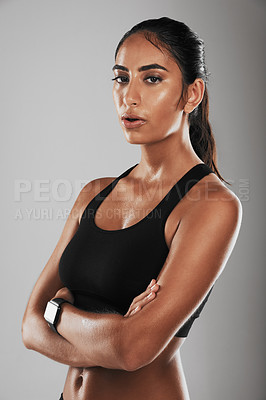 Buy stock photo Studio shot of a fit young woman against a gray background