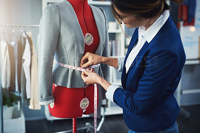 Buy stock photo Fashion, tailor and measuring tape on mannequin in boutique workshop with creative seamstress. Luxury, designer and professional woman fitting formal clothes in retail, small business or warehouse 
