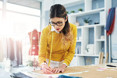 Buy stock photo Cropped shot of an attractive young fashion designer in her workshop