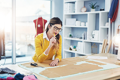 Buy stock photo Cropped shot of an attractive young fashion designer in her workshop