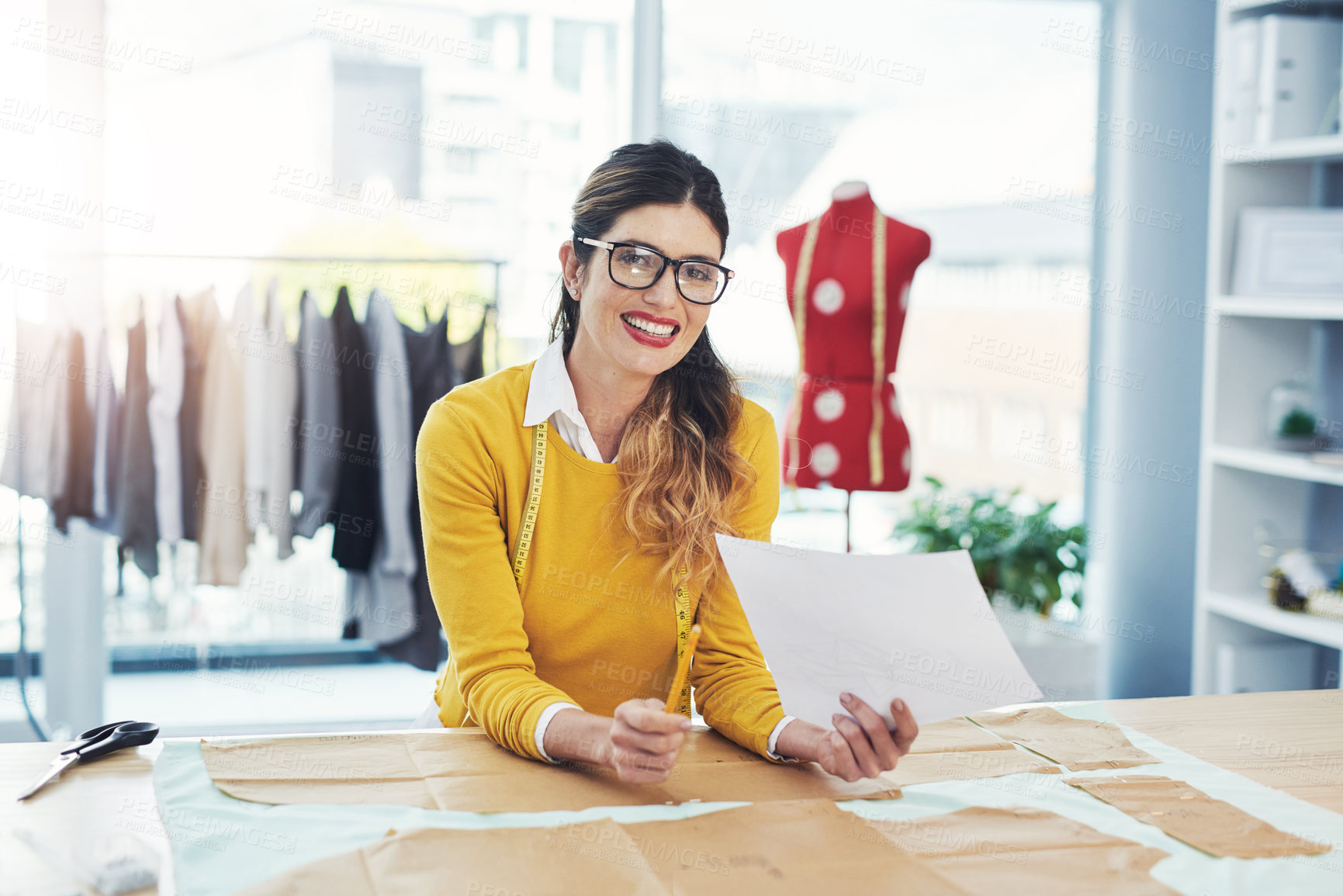 Buy stock photo Cropped portrait of an attractive young fashion designer in her workshop