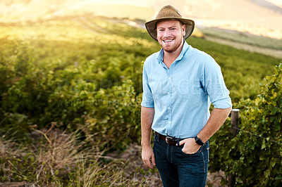 Buy stock photo Portrait of a farmer standing in a vineyard