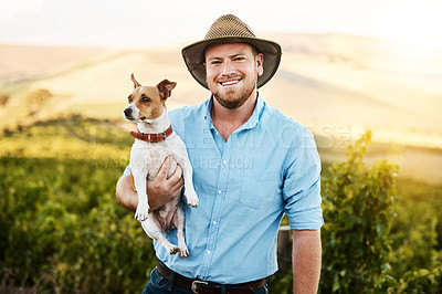 Buy stock photo Man, farmer and happy with dog in portrait, vineyard and outdoor in sunshine for grapes, growth and development. Person, animal or pet with care, love or hug in nature, countryside or summer in Spain