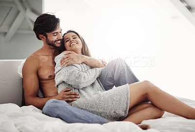 Buy stock photo Cropped shot of an affectionate young couple in their bedroom at home