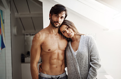 Buy stock photo Portrait of an affectionate young couple in their bedroom at home