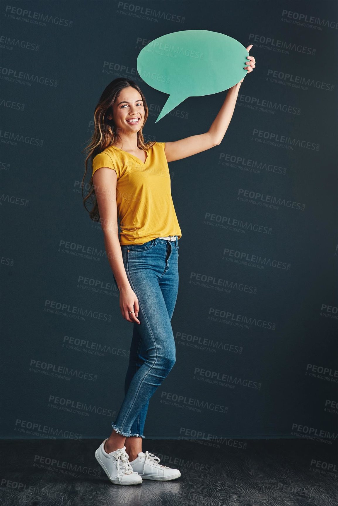 Buy stock photo Portrait, girl and speech bubble in studio for announcement, public speaking and social media news. Female person, message icon and dark background with mock up for opinion, review and storytelling.