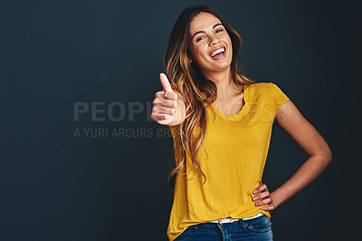 Buy stock photo Happy, portrait and a woman with a thumbs up for success, agreement and yes sign. Smile, thank you and a lady with a hand gesture isolated on a dark background in a studio with mockup for motivation