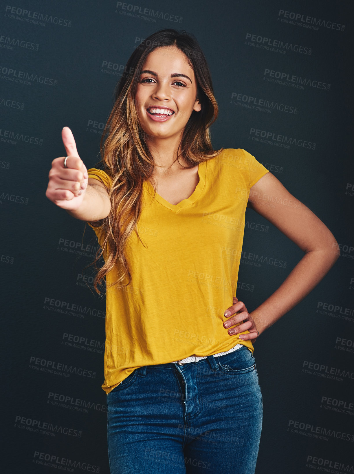 Buy stock photo Thank you, portrait and a woman with a thumbs up for success, agreement and yes sign. Smile, like and a lady with a hand gesture isolated on a dark background in a studio for motivation and a goal