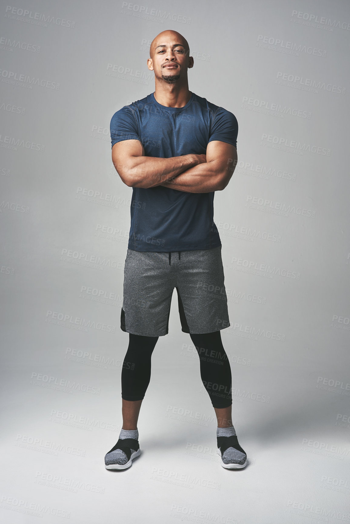 Buy stock photo Personal trainer, man and fitness in studio for confident, motivation and wellness for athlete. Coach, sport and African male person on backdrop for exercise, bodybuilder and health training. 