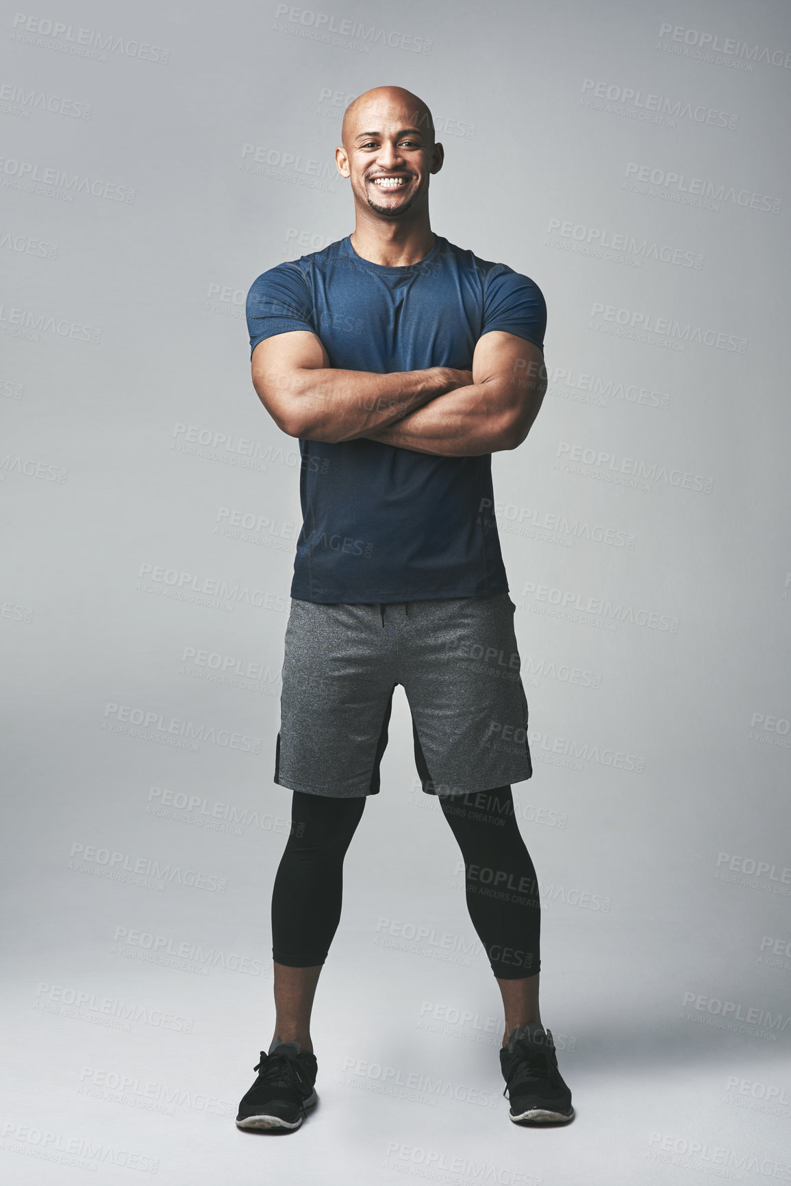 Buy stock photo Black man, portrait and arms crossed in studio for fitness, strong and sportswear for workout or training. Male person, athlete and pride for progress on gray background, care and body challenge