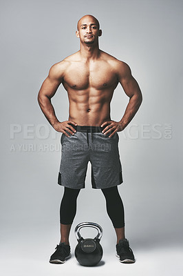 Buy stock photo Studio portrait of a shirtless young man standing with his hands on his hips against a grey background