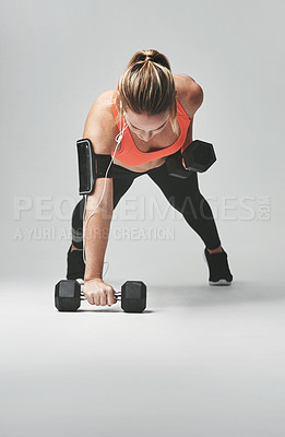 Buy stock photo Push up, arms and woman with weights in studio for health, wellness and body training. Fitness, energy and female athlete with equipment for sports workout or exercise isolated by gray background.