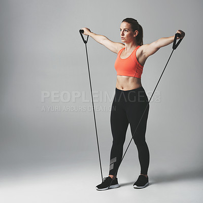 Buy stock photo Woman, fitness and resistance band in studio with stretch for healthy athlete with training for wellness. Body care, gym and confidence with commitment on white background with workout for exercise
