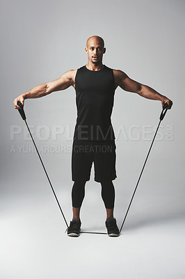 Buy stock photo Man, fitness and stretch band in studio with workout for health with athlete for training with wellness. Body care, gym and confidence with commitment for motivation with exercise on gray background