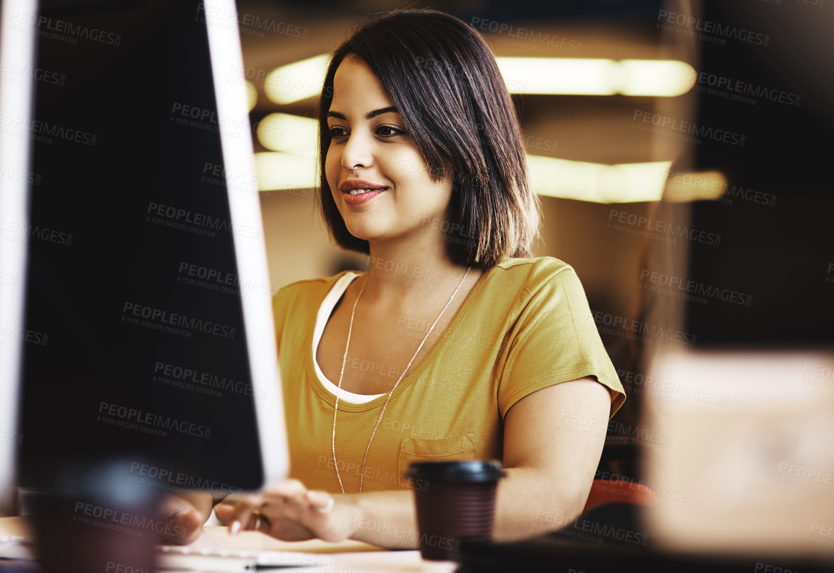 Buy stock photo Cropped shot of a businesswoman working on a computer in an modern office