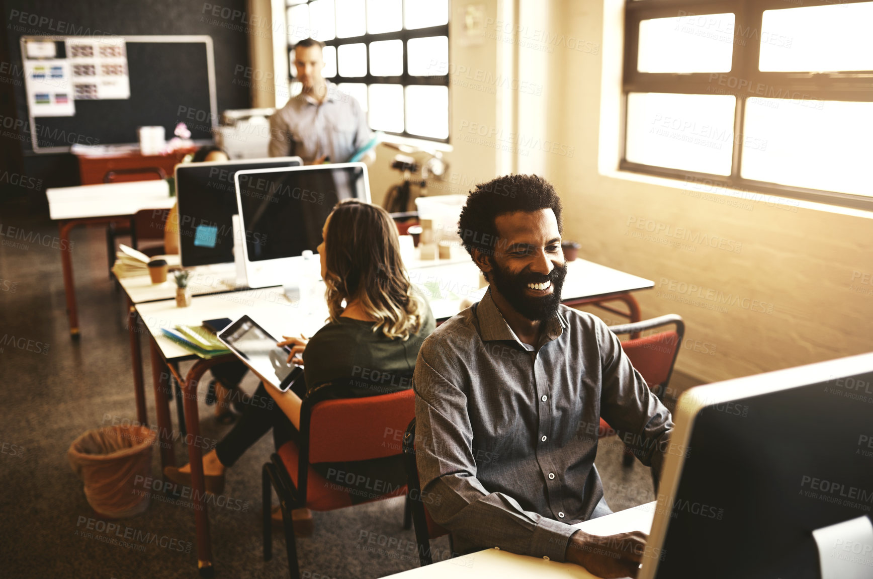 Buy stock photo Business people, computer and man in office typing and internet with planning, email notification and smile. Employees, consultant and coworkers with startup, copywriting and deadline for project