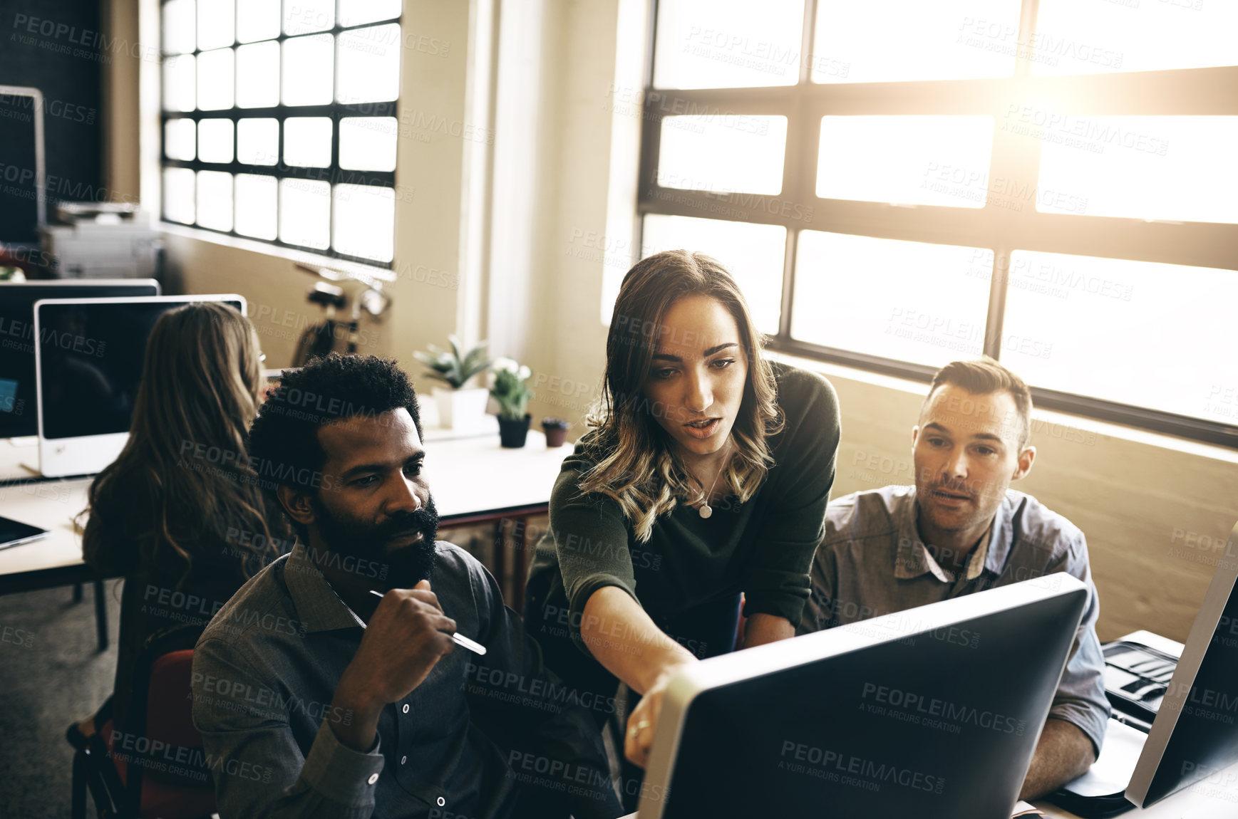 Buy stock photo Cropped shot of colleagues discussing something on a computer