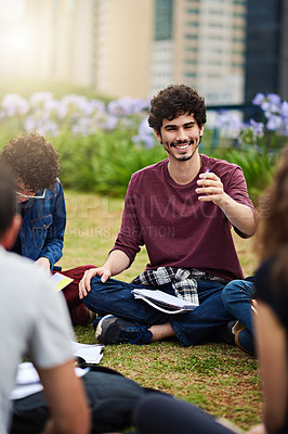 Buy stock photo Cropped shot of a group of college students having a discussion while sitting in a circle outside