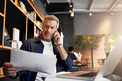 Buy stock photo Cropped shot of a handsome mature businessman working in his local internet cafe
