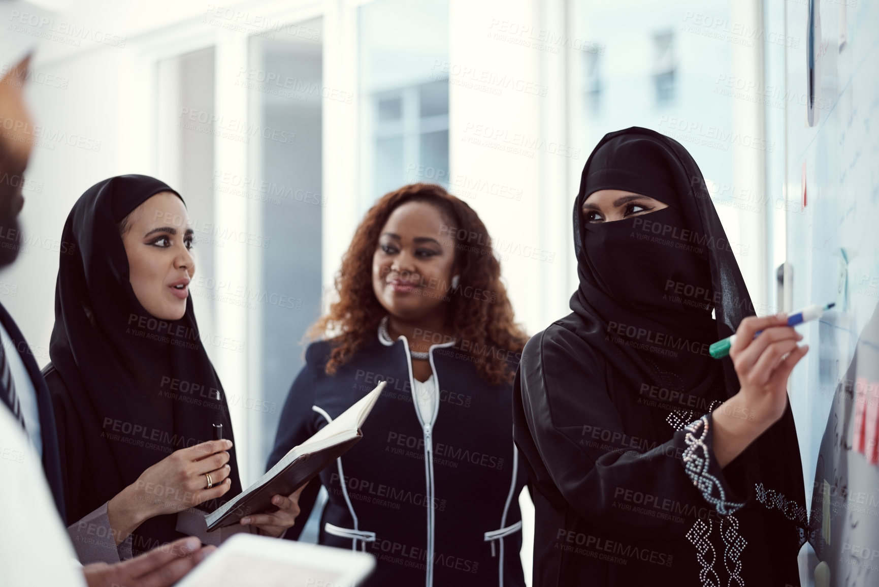 Buy stock photo Training, team and business muslim woman in office for investor workshop, presentation and teaching. Stakeholder update, coaching and speaker with employees in conference for meeting in Qatar