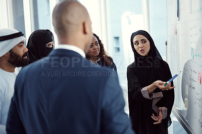 Buy stock photo Training, people or team at whiteboard in office for trading tips, finance upskill or muslim speaker. Coaching, investors and arab coworkers in workshop for stocks advice, market trends and diversity