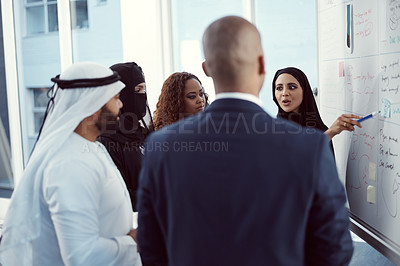 Buy stock photo Planning, presentation and discussion of business people in office for team, trading workshop and conference. Investment, middle east advisor and speaker with group of employees at expo in Dubai