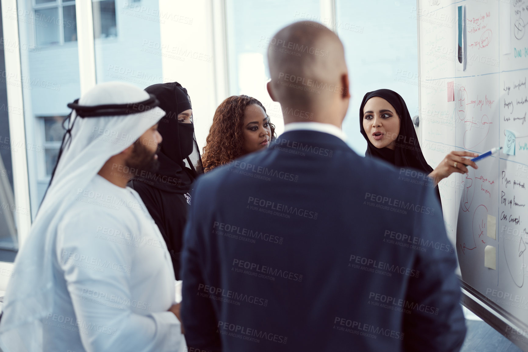 Buy stock photo Planning, presentation and discussion of business people in office for team, trading workshop and conference. Investment, middle east advisor and speaker with group of employees at expo in Dubai