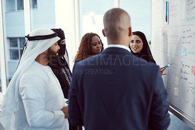Buy stock photo Training, people or speaker at whiteboard in office for trading presentation, tips and finance upskill. Coaching, investors or arab coworkers in workshop for stocks advice, market trends or inclusion