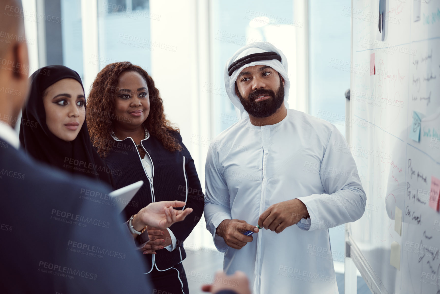 Buy stock photo Planning, presentation and team of business people in office for meeting, trading workshop and conference. Investment discussion, middle east advisor and speaker with employee at expo in Dubai