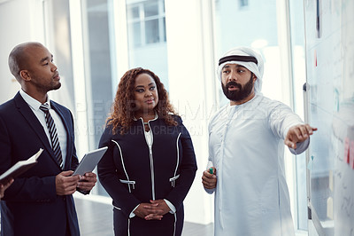 Buy stock photo Meeting, speaker and team of business people in office for planning, trading workshop and conference. Presentation, employees and investment discussion with middle east advisor at expo in Dubai 