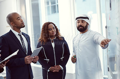 Buy stock photo Planning, speaker and team of business people in office for meeting, trading workshop and conference. Investment discussion, middle east advisor and presentation with employee at expo in Dubai 
