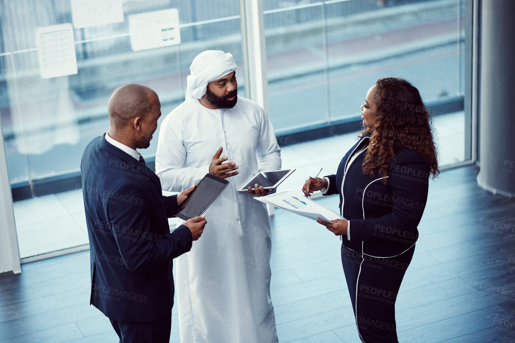 Buy stock photo Meeting, above and team of business people in office for planning, trading workshop and conference. Investment discussion, middle east advisor and collaboration with employee at expo in Dubai 