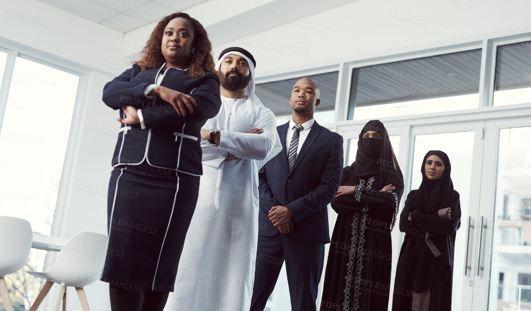 Buy stock photo Business, people and leader in row in office for legal representation, muslim coworkers or trust. Low angle, lawyers or arab colleagues at firm for company diversity, arms crossed or career integrity