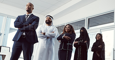 Buy stock photo Low angle shot of a diverse group of business colleagues standing in a single line in their corporate office