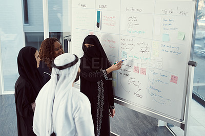 Buy stock photo Training, teaching and business muslim woman in office for investor workshop, team and presentation. Speaker, coaching and stakeholder update with employees in meeting at conference in Qatar