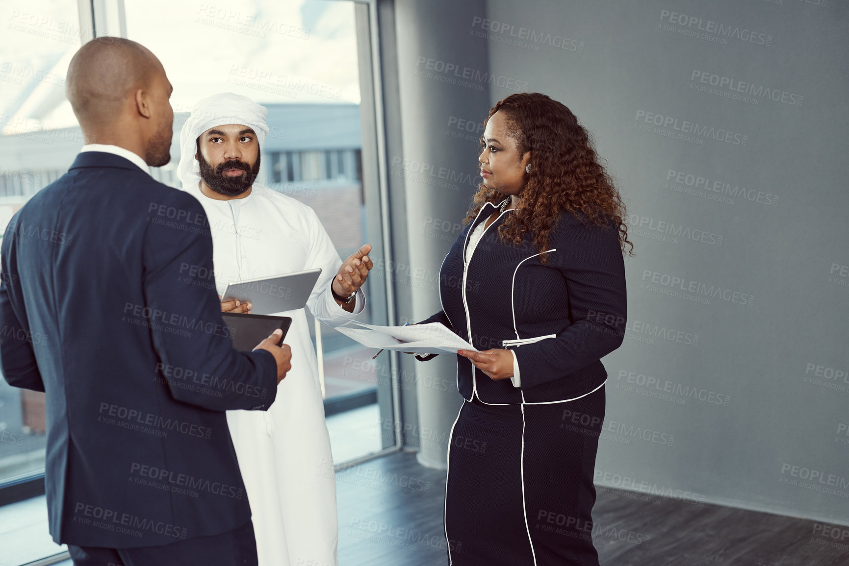 Buy stock photo Meeting, planning and discussion with business people in office for trading workshop, team and b2b advisor. Partner, employees and portfolio manager with Middle east representative at expo in Qatar
