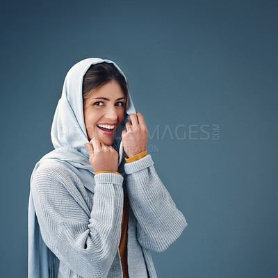 Buy stock photo Cropped portrait of an attractive young woman posing against a grey background