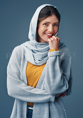Buy stock photo Woman, studio and smile with hijab in portrait with confidence with happy for islamic culture. Beauty, faith and pride with blue background for Arab people with natural, religion and middle east