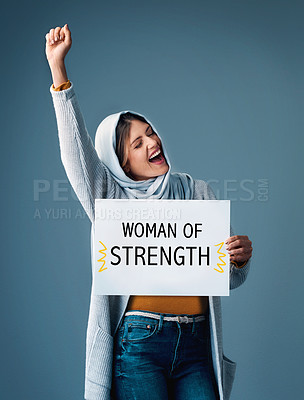 Buy stock photo Muslim, woman and poster with fist up in studio on blue background for equality, empowerment and activist. Female person, placard and shout in confidence for human right campaign and advocate