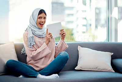 Buy stock photo Portrait, sofa and Muslim woman with tablet for internet, social media and live streaming. Happiness, smile or Islamic girl to relax on couch with tech for connectivity at home, house and living room