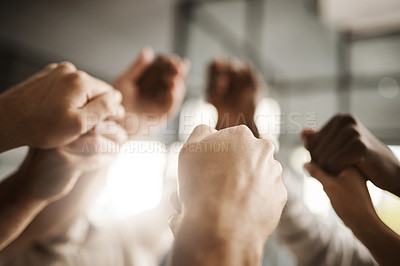 Buy stock photo Diverse people hold hands in teamwork, success and support while showing solidarity, trust and unity in office. Closeup of business team, men and women standing together for equal workplace rights 